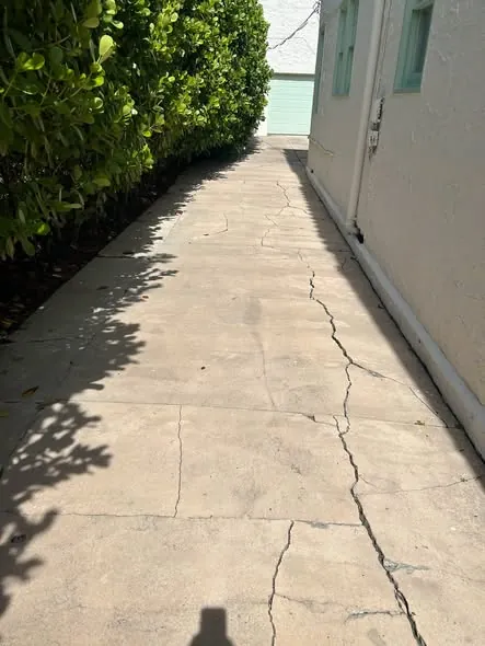 Side-yard concrete slab with a network of wide cracks