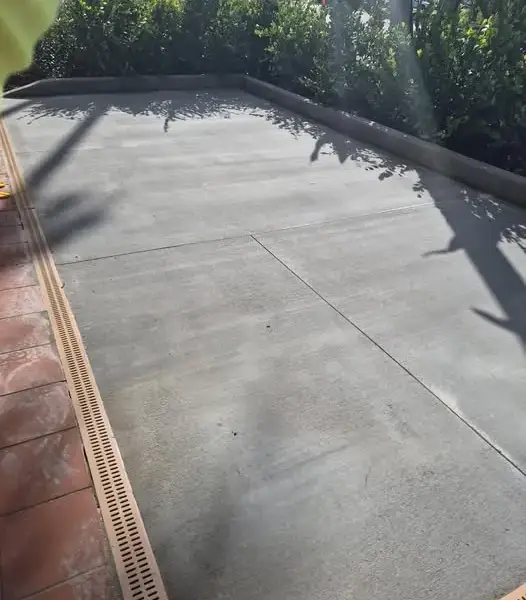 New concrete slab with a channel drain along the edge
