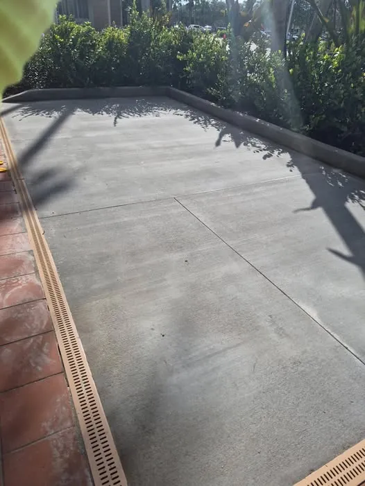 New concrete slab with a channel drain along the edge
