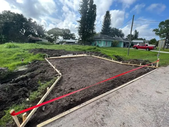Driveway extension area dug out and formed with wood stakes