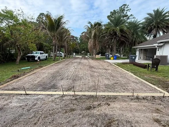 Driveway formed with wood edges and wire mesh laid before the pour