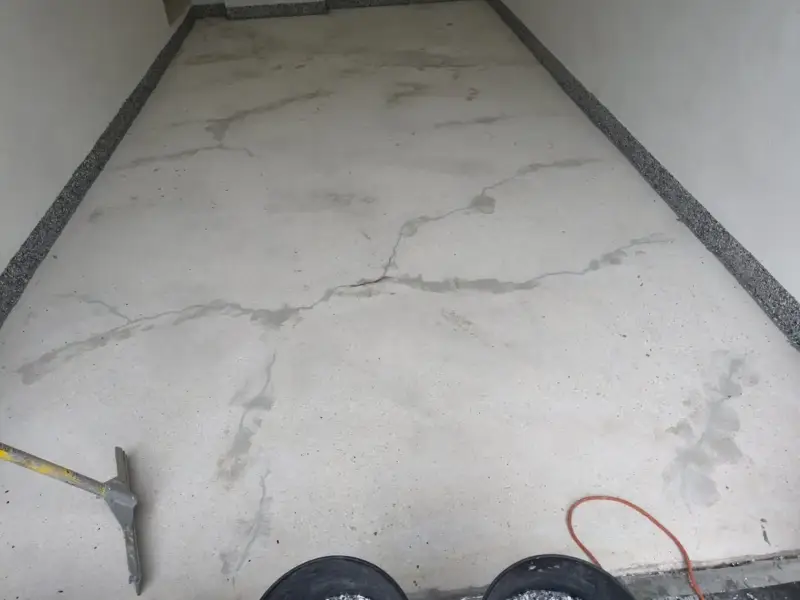 Before: cracks filled first, then a full flake coating over the whole floor.