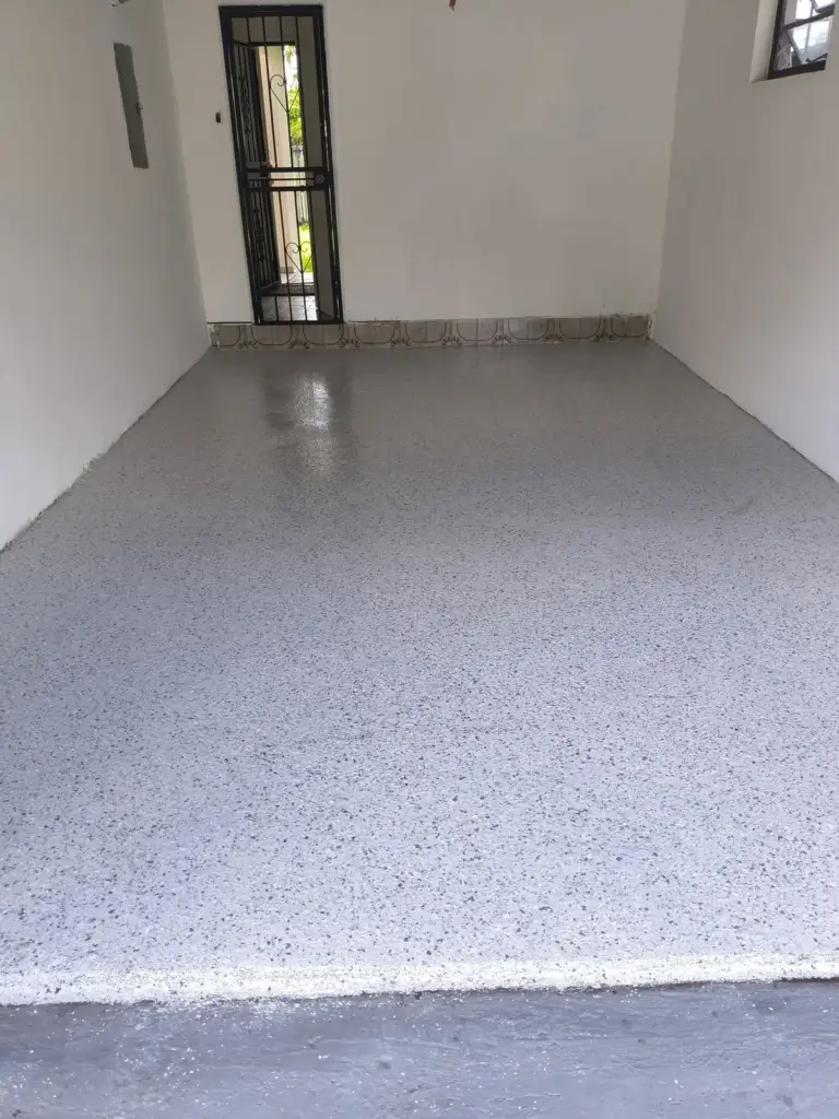 Narrow garage with a light grey flake floor coating