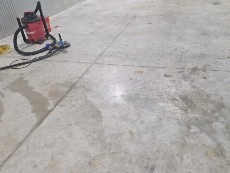 Before: a bare slab finished with a metallic epoxy floor.