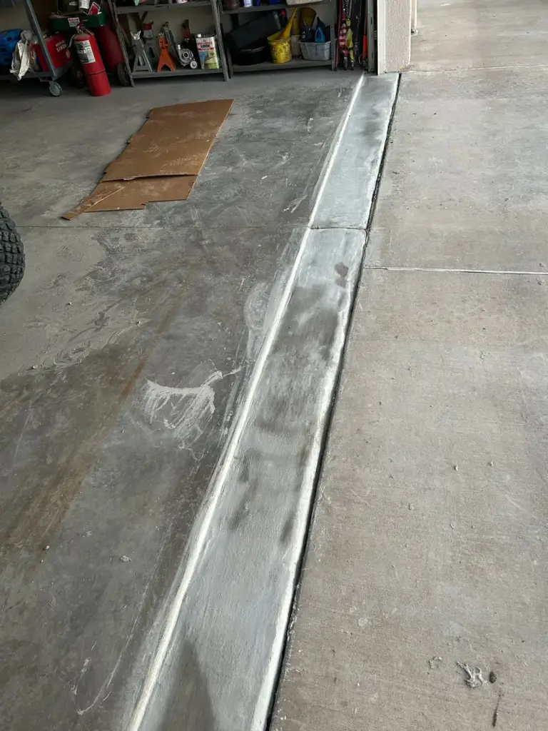 Garage threshold edge rebuilt with new repair mortar