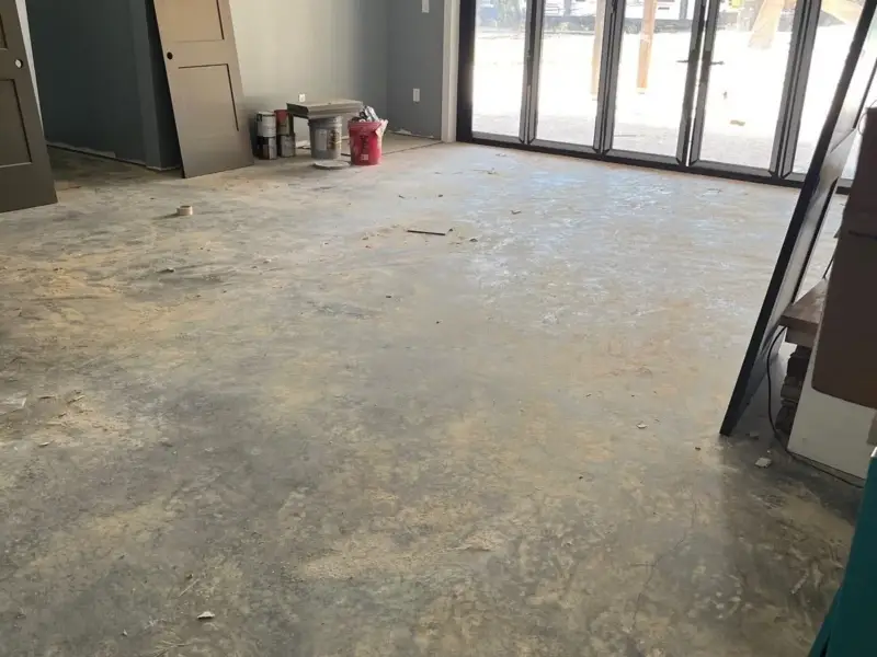 Before: a dusty interior slab stained and sealed to a gloss.