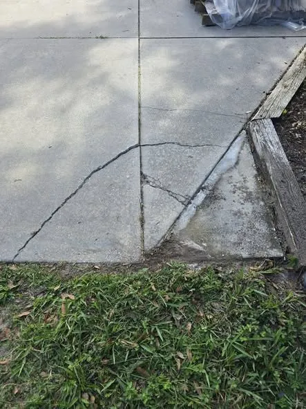 Before: a cracked slab corner cut out and re-poured.
