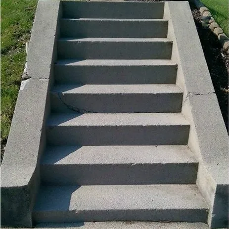 Before: cracked, broken steps rebuilt and resurfaced.