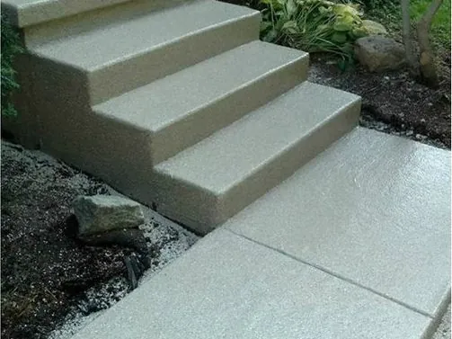 After: worn steps and a broken walkway resurfaced together.